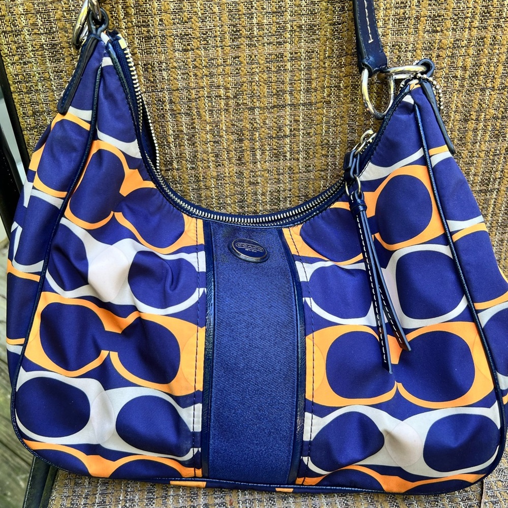 Navy and orange Coach hobo bag